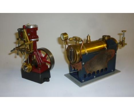 A vertical steam engine with single cylinder gearing and fly wheel, frame cast with "S", 6" high, and a horizontal steam boil