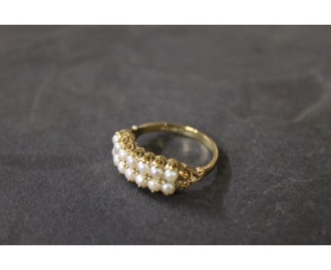 A 9 ct gold seed pearl double strand ring, marked .375, ring Size N, gross weight 2.5 grams. CONDITION REPORT: In good used c