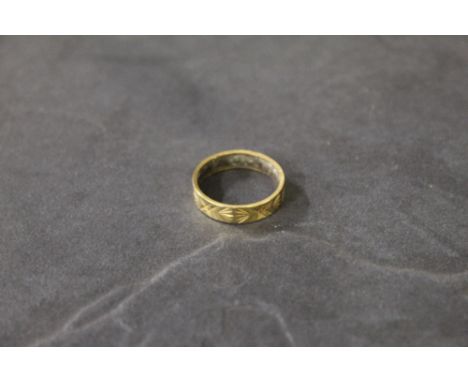 A 9 ct gold wedding bank with engraved decoration, marked .375, ring Size M/N, gross weight 3.1 grams.  CONDITION REPORT: In 