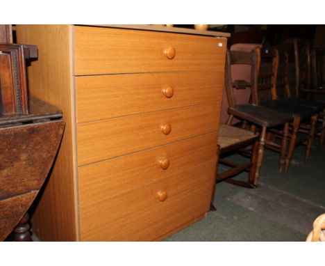 A teak effect laminate chest of drawers, 77 x 46 x 95 cm high. CONDITION REPORT: In good overall condition with some slight r