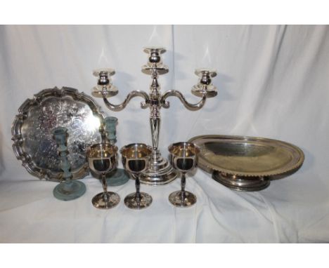 A box of miscellaneous silver plated wares, salver, three branch candelabra, chalices and quantity of King or Queens pattern 