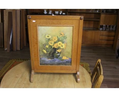 A vintage oak fire screen, the centre inset with a print of sunflowers. 72 cm x 54 cm.  CONDITION REPORT: Some marks and scra