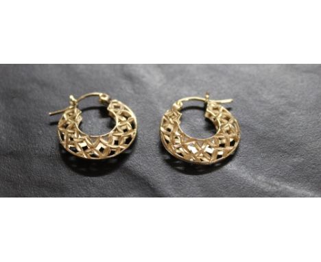 A pair of yellow metal bracket (thought to be gold) gold hoop earrings, with pierced decoration, 1.9 grams gross weight.   CO