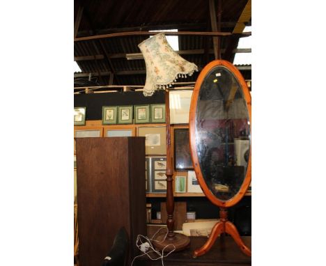 A mahogany turned and reeded standard lamp, with foliate patterned shade, 155 cm to fitting. CONDITION REPORT: Some marks and