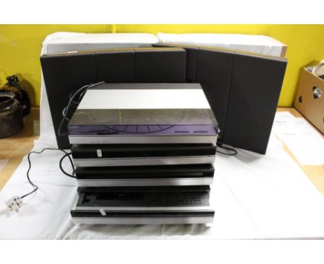 A Bang and Olufsen 5500 Series music system, comprising master control panel, Beomaster, Beogram, Beochord and Beogram CD, to