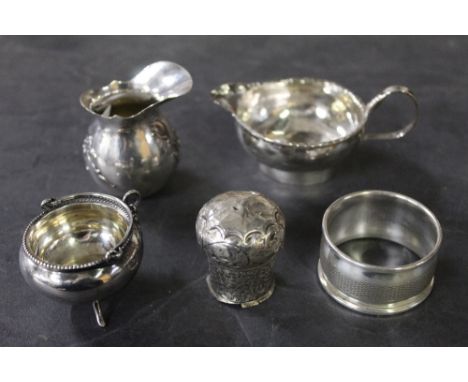 Five unmarked unmarked white metal items, comprising 2 jugs, napkin ring, cauldron form salt and a small Indian pot.  Gross w