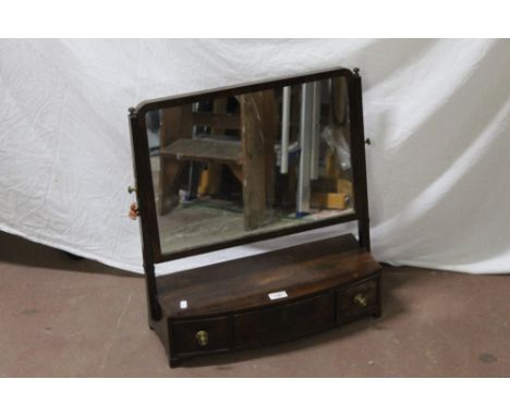 A George III mahogany bow front toilet mirror, with three drawers. 54 cm x 47.5 cm x 19 cm. CONDITION REPORT: Some marks and 