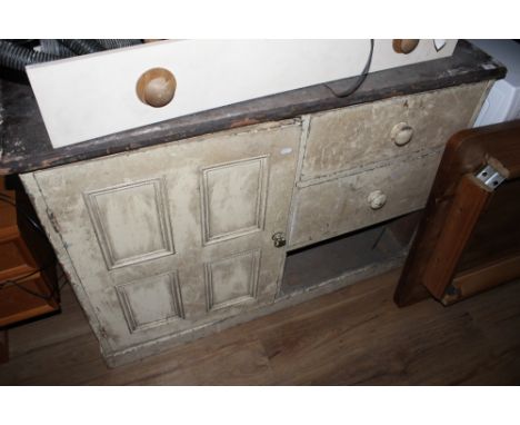 A Victorian cream painted pine cupboard, having a rectangular top over a quadruple panelled door and three drawers, 92 cm x 1