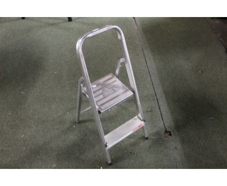 A small pair of aluminium step ladders, 82 cm.  CONDITION REPORT: In used condition but generally good throughout. 
