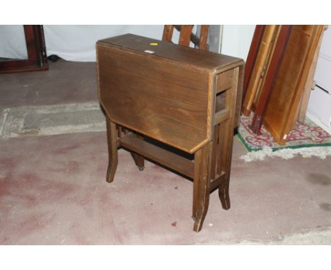 An Edwardian inlaid mahogany Sutherland table, 65 x 56 x 19 cm. CONDITION REPORT: Ring marks to the top and some other water 