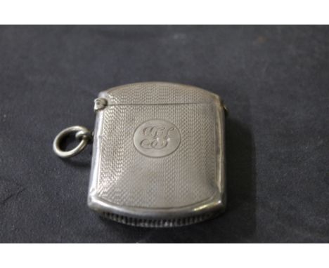 An Edwardian engine turned silver Vesta case, marks for Birmingham 1905, makers mark CF. 5 cm x 3.5 cm, weight 24 grams. COND