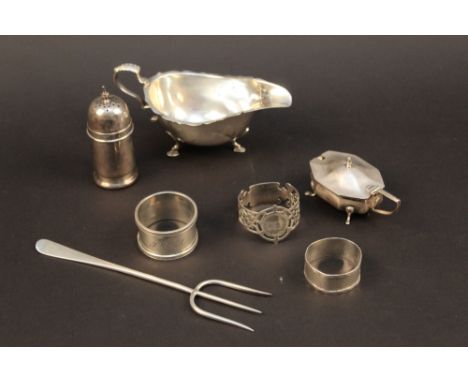 A small quantity of miscellaneous silver, comprising a pickle fork, 3 napkin rings, mustard, pepperette and a gravy boat, var