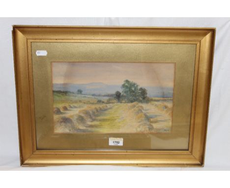 A small 19th century watercolour , of corn stooks, initialled HBS, within a gilt card mount and gilt frame. Together with an 