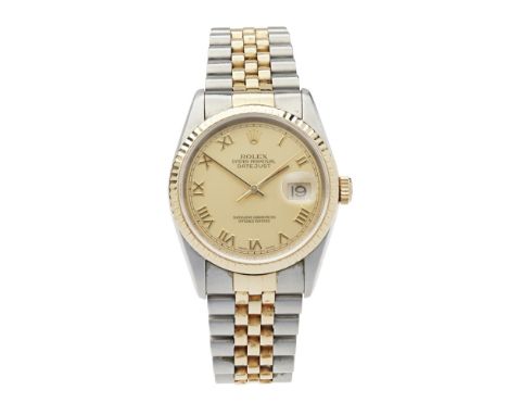A gentleman's gold and stainless steel wrist watch, Rolex    Oyster perpetual datejust, champagne dial, gilt Roman numerals, 