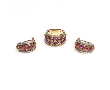 A ruby and diamond set ring    of broad design, set with baguette-cut rubies in a 'crossed' pattern, and throughout with grad