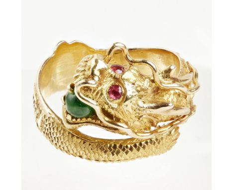 A Chinese multi-gem set ring    modelled as a coiled dragon, with a jade cabochon and two garnet set eyes, stamped 18    Ring