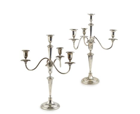 A pair of four light table candelabrum    Brook and Sons, Sheffield 1931, the stems of tapering octagonal form, plain branche