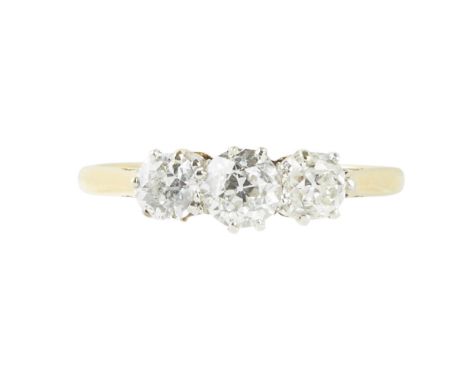 A three stone diamond ring    claw set with three graduated old cut diamonds, to a plain yellow metal shank    Ring size: N/O