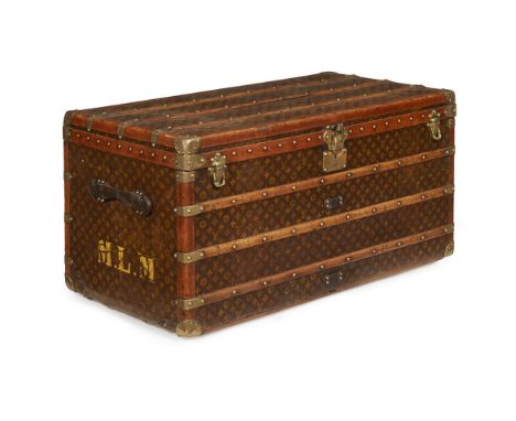 An early 20th century Louis Vuitton steamer trunk    covered in LV monogram leather with brown leather corners and ash strap 