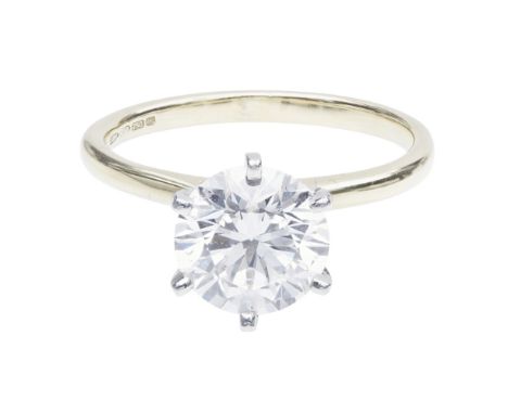 A single stone diamond ring    claw set with a round-brilliant cut diamond, to a plain 18ct gold shank; with accompanying GIA