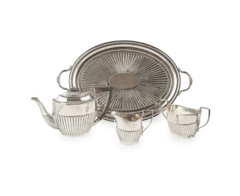 A three piece tea service    GJ Ltd, Birmingham 1919, of oval form, demi ribbed, comprising a teapot, sugar and basin, with a