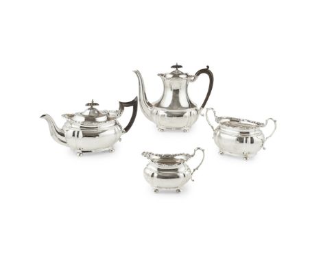 A four piece tea and coffee service    William Aitken, Birmingham circa 1910, various dates, of oval form, scrolling cast bor