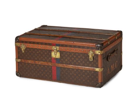 A Louis Vuitton striped trunk    covered in signature monogram canvas with brown leather trim, wood straps and brass stud det