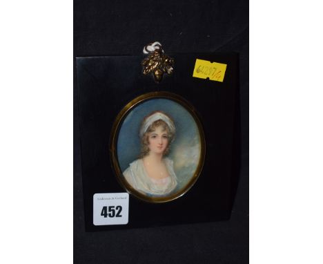 An early 20th Century bodycolour on ivory - portrait of an 18th Century lady, in ebonised frame.