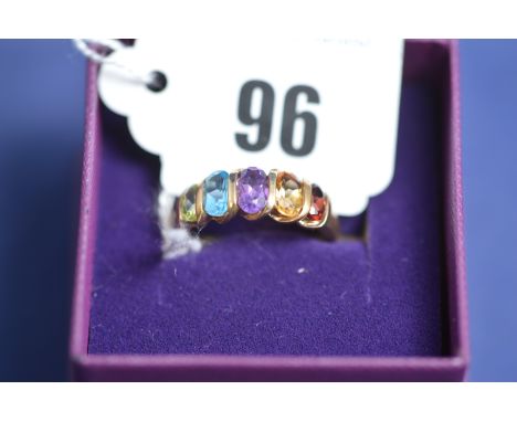 A gem set ring, to include garnet, citrine, amethyst, topaz and peridot, ring size P.