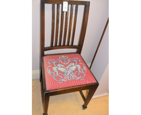A set of four stained wood rail back dining chairs, the seats upholstered in hand-worked tapestry; and two further mahogany r