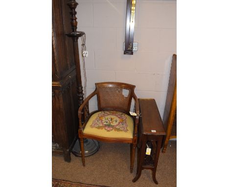 An Edwardian inlaid mahogany Sutherland occasional table; an inlaid mahogany occasional elbow chair with cane back panel (dam