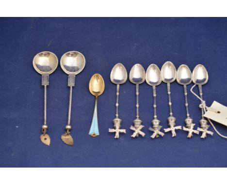 A set of six foreign silver (probably Dutch) teaspoons with 'Windmill' pattern handles, stamped "C" and other hallmarks; toge