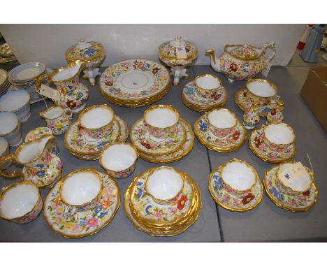 A Hammersley & Co. 'Queen Anne' pattern part dinner and tea service, decorated with naturalistic flowers and gilt borders, co