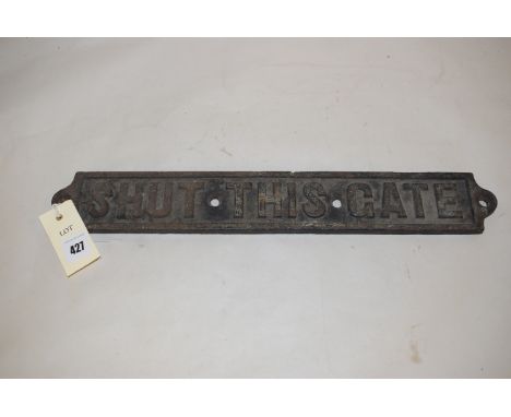 A cast iron railway sign "Shut This Gate".