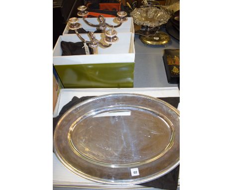 Christofle, Paris: a plated oval tray with gadrooned rim, 55 x 38cms (21 1/2 x 15in.); together with a pair of matching two-b