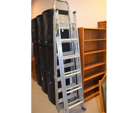 A set of Abru three-way step ladders; and another set of folding steps. (2)