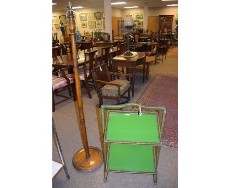 A mahogany standard lamp and a two tier cane work cake stand  with folding trays.