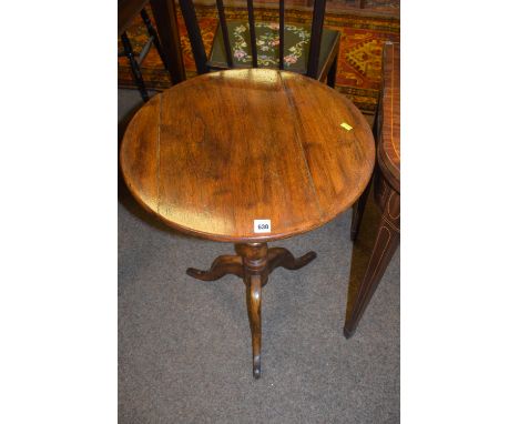 A 19th Century oak circular tripod table, 49.5cms diameter.