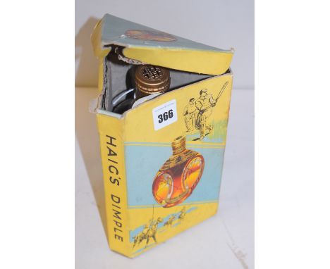 A bottle of Haig's Dimple Scotch Whisky, in original box - mid 20th Century.