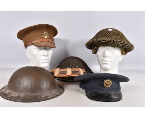 A SELECTION OF WWII ERA AND LATER MILITARY HATS, this lot includes a steel helmet dated 1940 with net cover and AFS on the fr