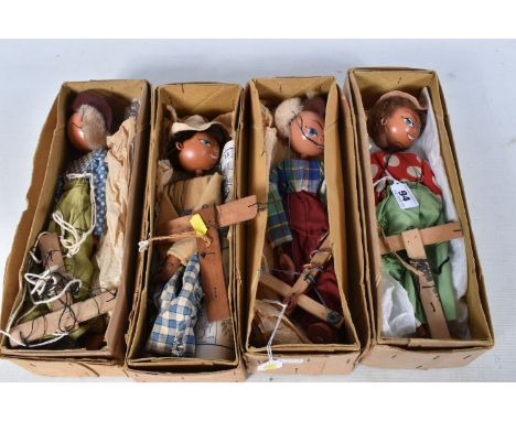 FOUR BOXED PELHAM SS COWBOY PUPPETS, all in different outfits, with a boxed Pelham SS Cowgirl puppet (missing hat), otherwise
