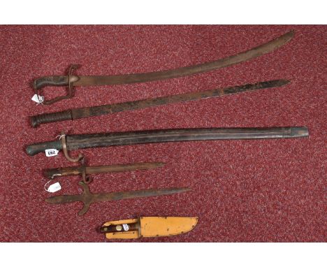 A SELECTION OF SWORDS, BAYONETS AND A SMALLER KNIFE, one bayonet is possibly British and one sword is Naval but they all have