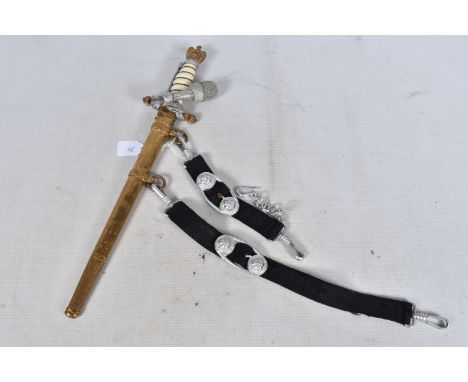 A GERMAN THIRD REICH NAVY OFFICERS DAGGER, this has a white wire bound grip and the pommel features and eagle and Swastika, t