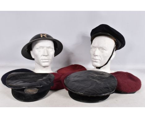 A 1939 DATED WWII STEEL HELMET AND OTHERS, to include six berets and three other hats, the steel helmet is missing its liner 