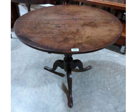 A 19th century snap-top table on tripod support. 31' diam.