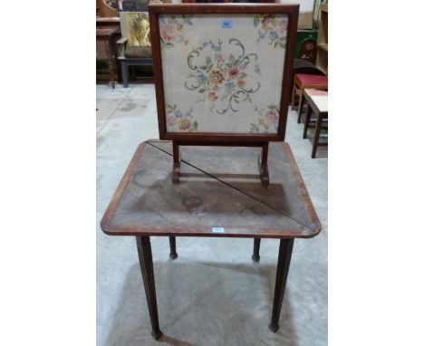 An oak card table and an embroidered folding firescreen