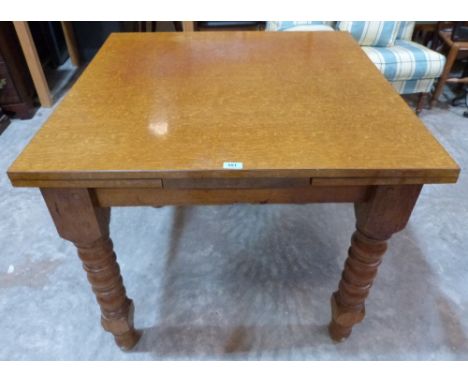 A light oak drawleaf dining table. 36' wide extending to 60'