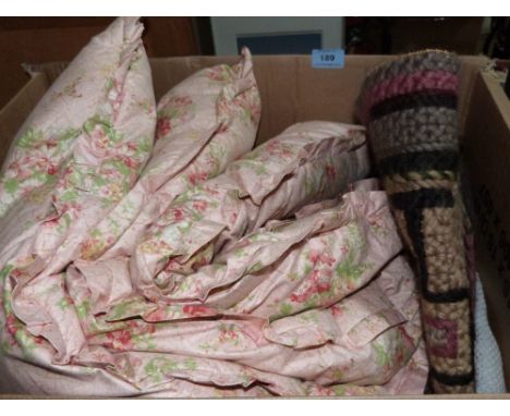 A crochet quilt, small rug and a feather eiderdown