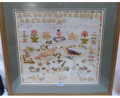 A framed needlework sampler. 19' x 21'