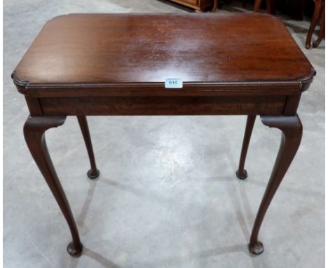 An early 20th century mahogany card table, the green baize lined fold-over top on cabriole legs with pad feet. 28' wide